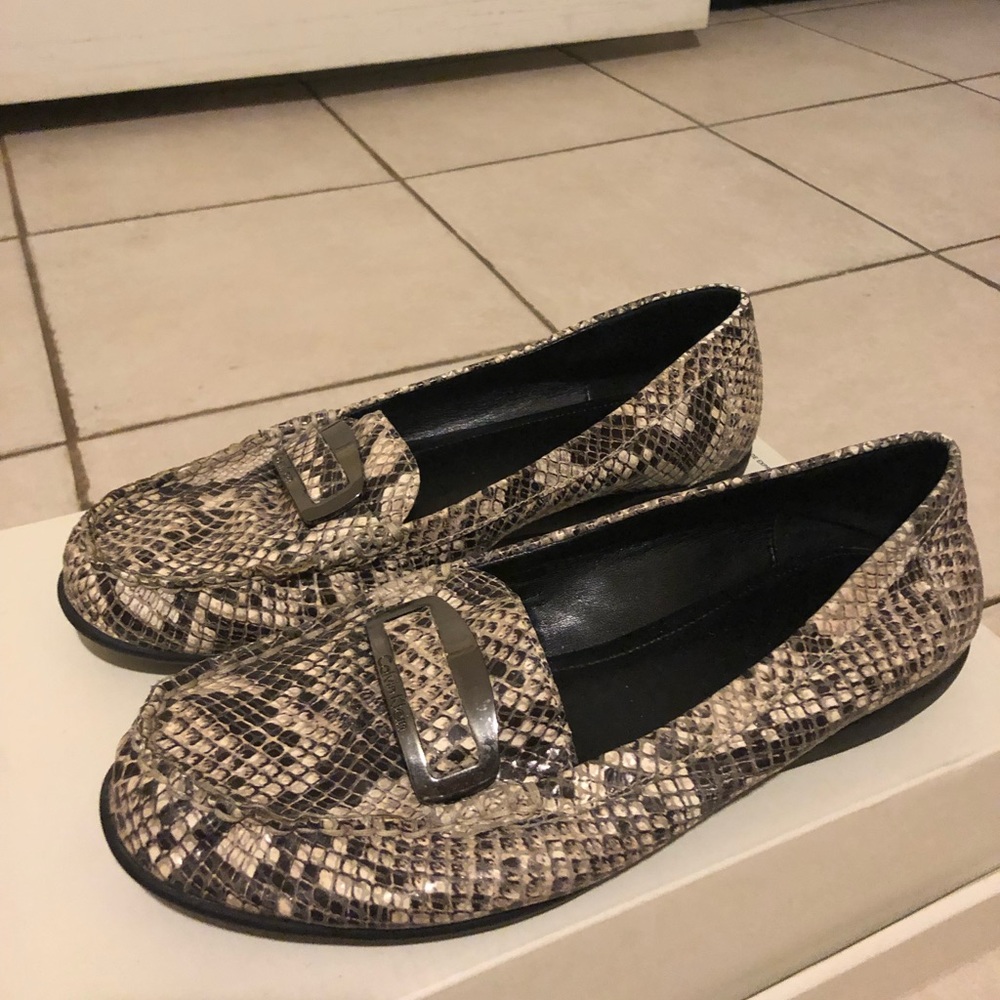 Calvin Klein Size 5 snake skin flats.